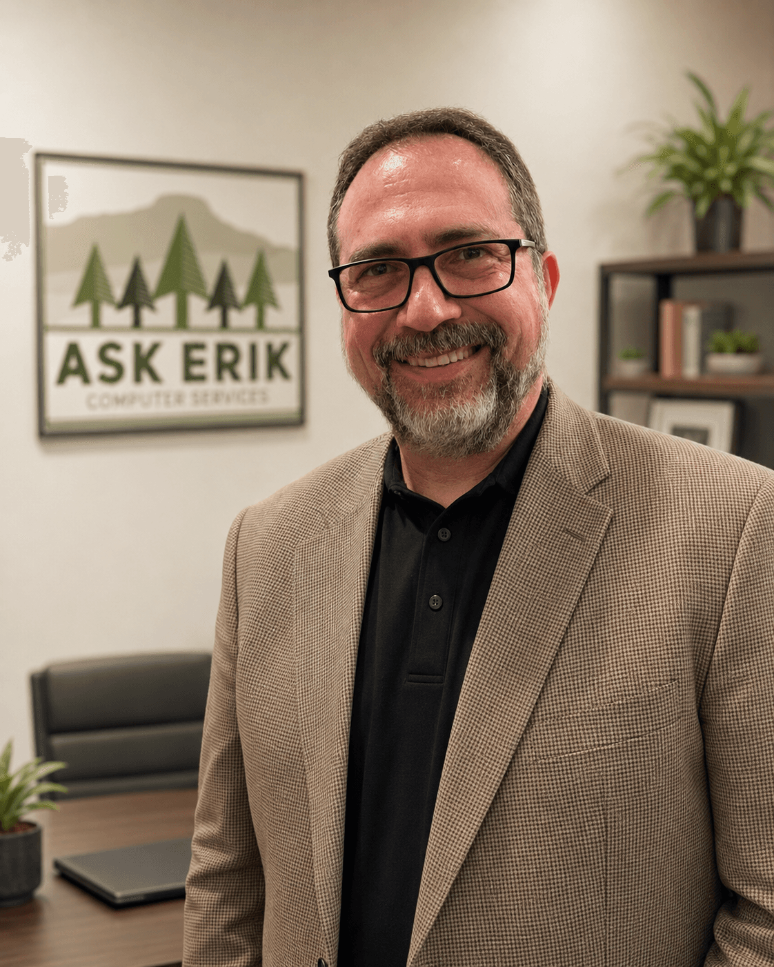 Erik, founder of Ask Erik Computer Services, in the Eugene office